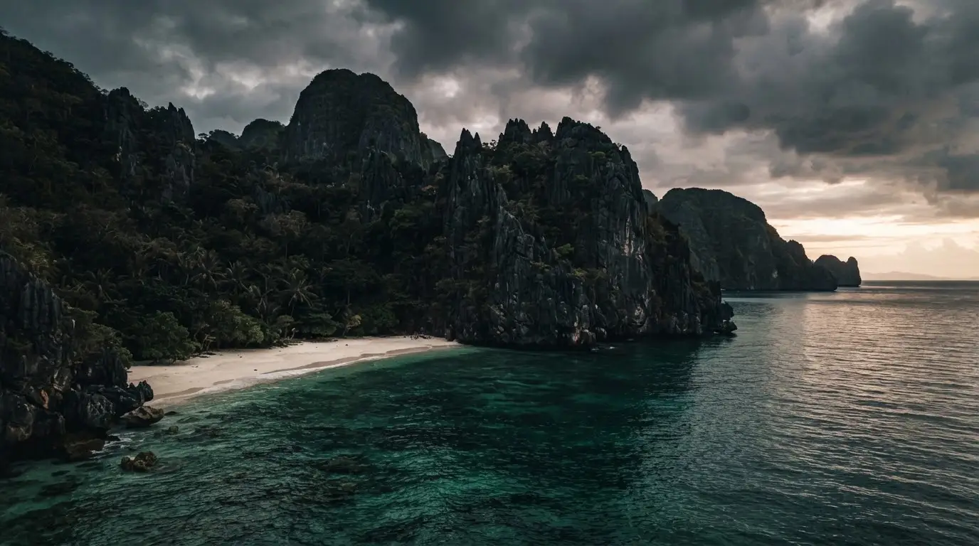 Limestone cliffs and empty water at dawn on a remote stretch of Palawan coastline